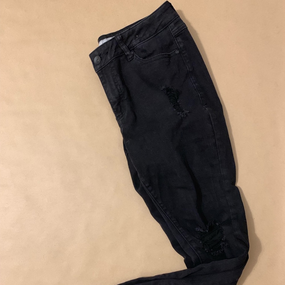 Skinny distressed black jeans